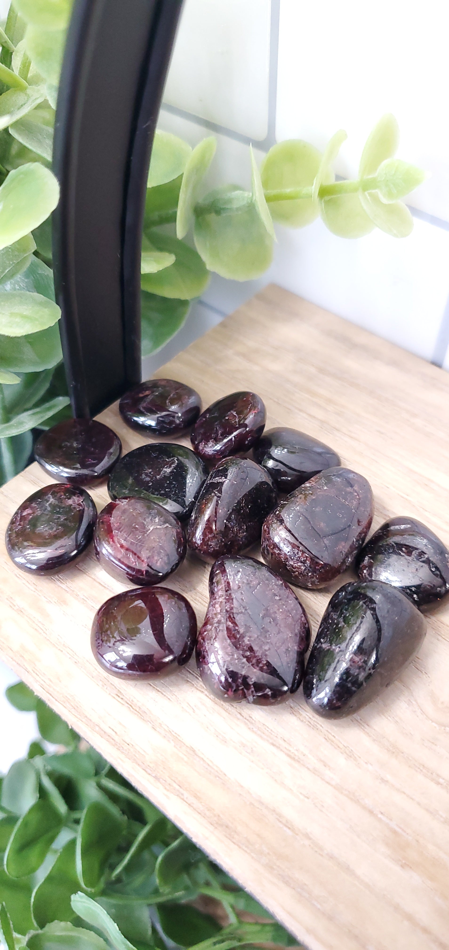 Garnet stones crystals in a pile on shelf