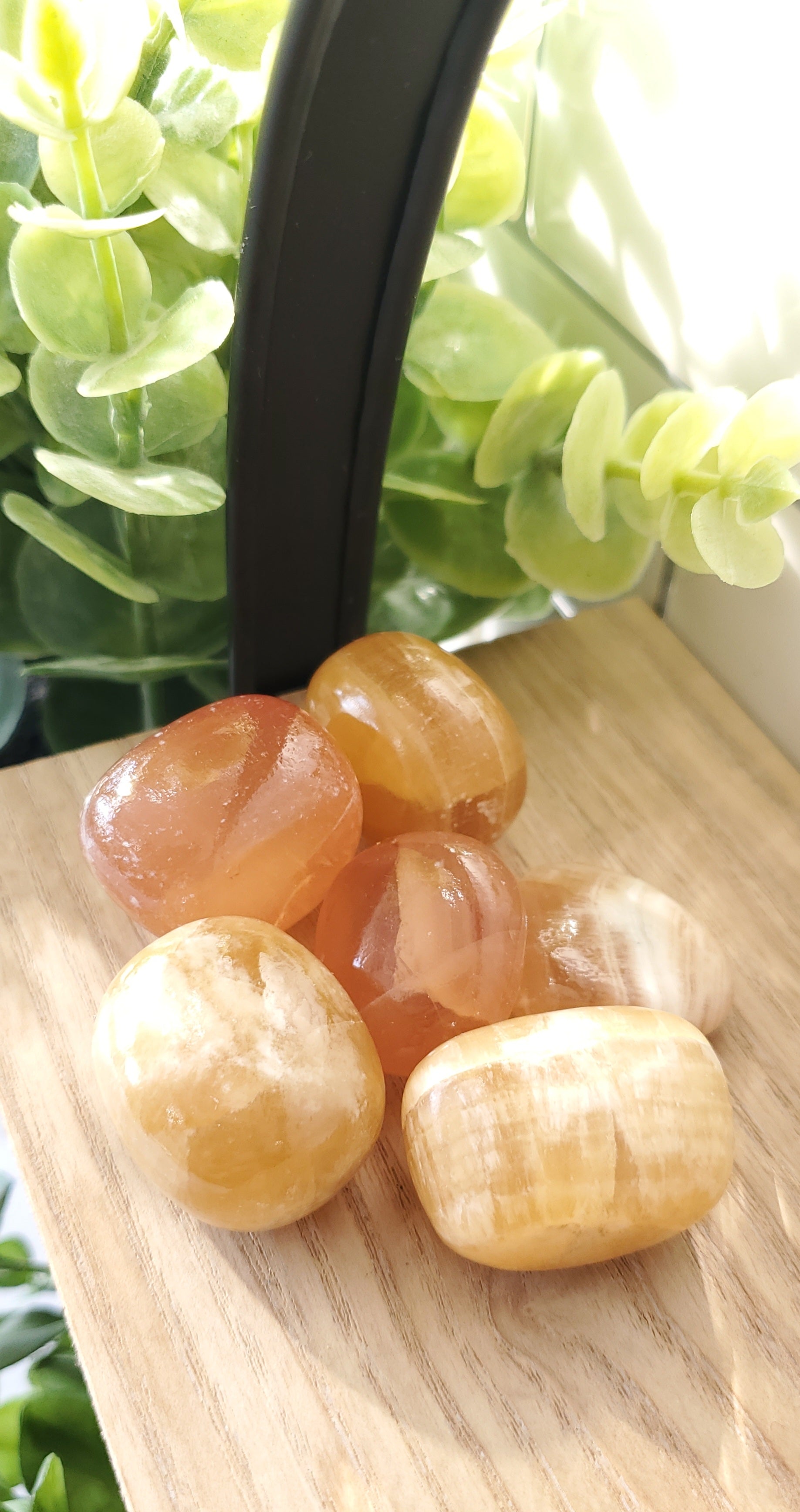 Honey Calcite piled up on a shelf