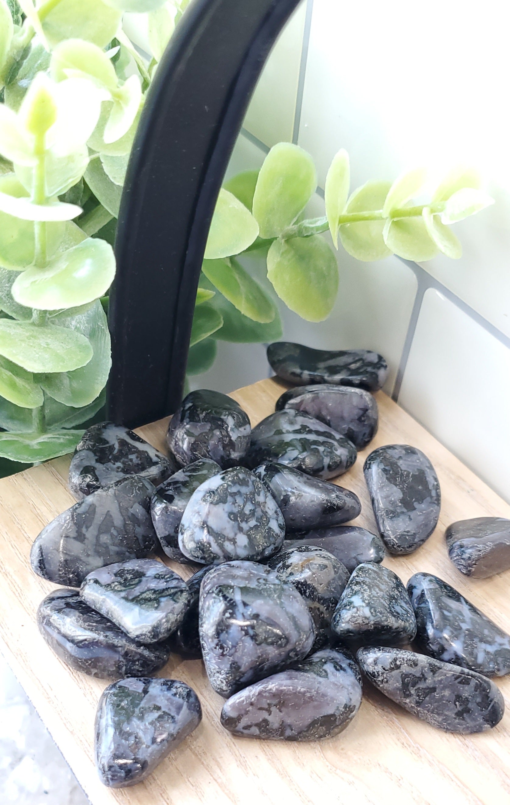 Indigo Gabbro piled up on wooden shelf