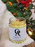 Shields Up Candle sitting on white fur