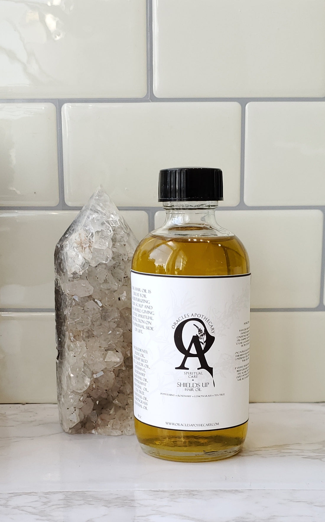 Shields Up Hair Oil sitting on white counter top