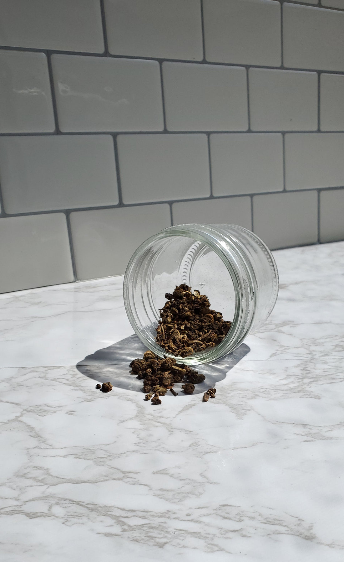 Valerian Root spilling out of a glass jar