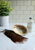 Wild Turkey Smudge Feather sitting on white countertop