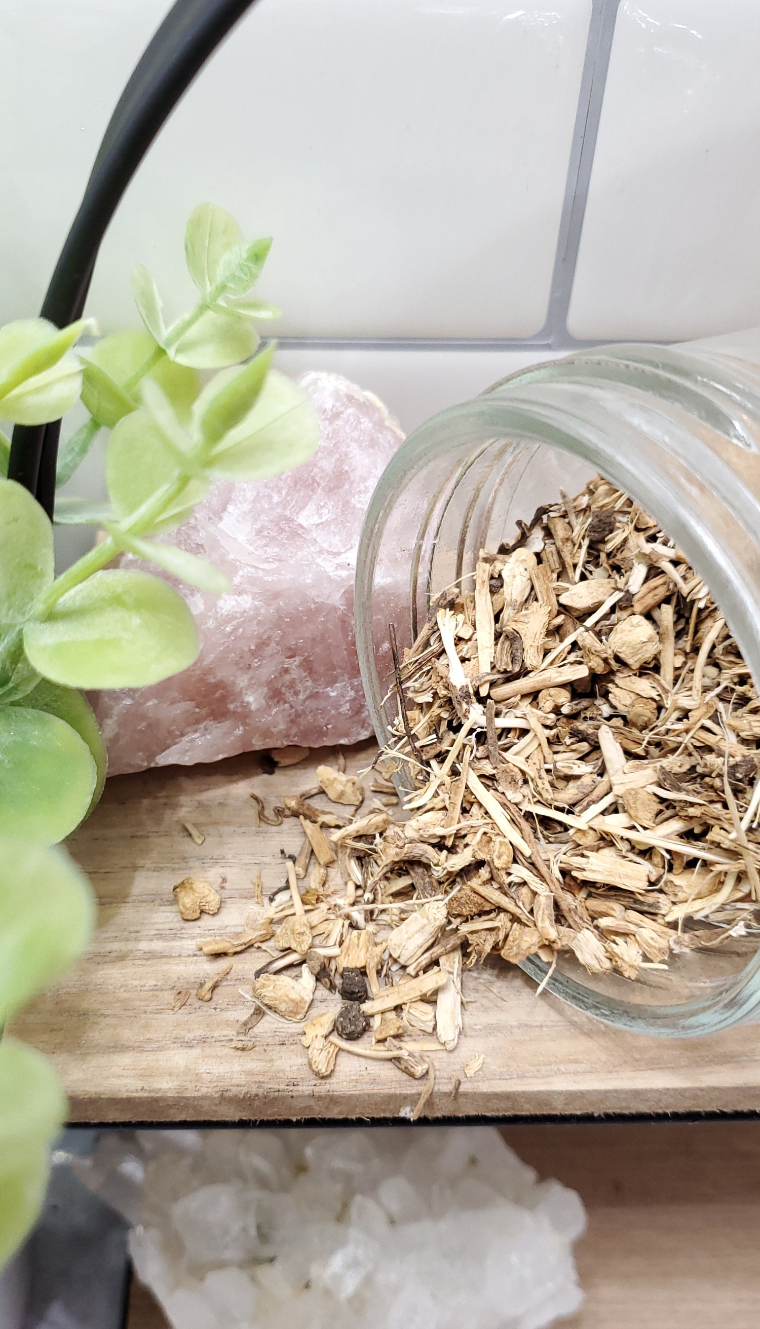 Butchers Broom Root spilling out of a glass jar