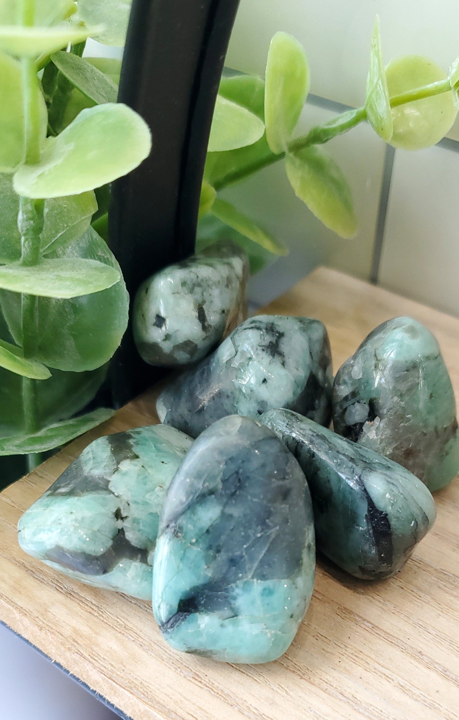 Emerald crystals stones piled up on a shelf