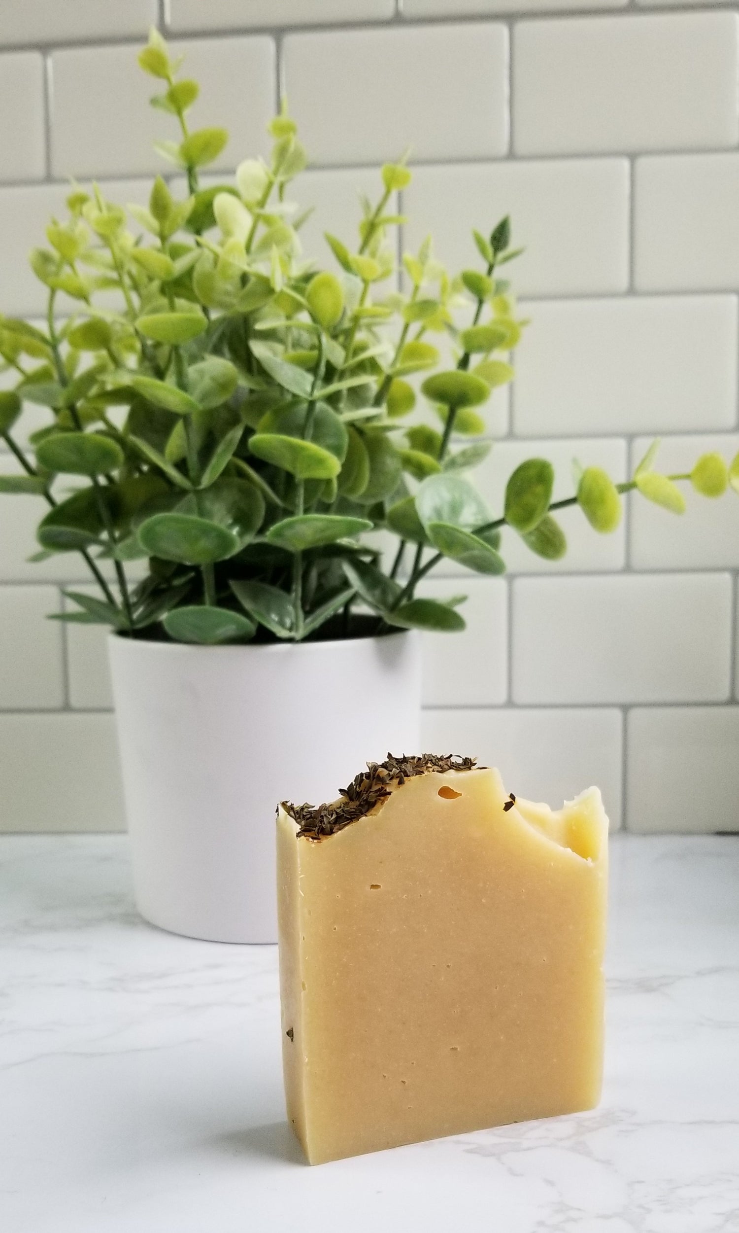 soap with herbs on top